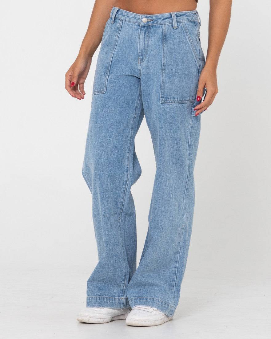 Side angle of Rusty Billie Low Rise Carpenter Pant showcasing pocket details.