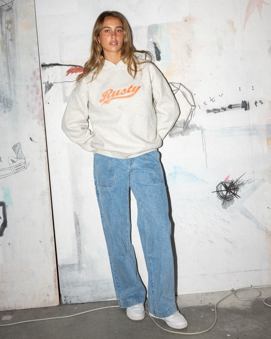 Model styled in Rusty Billie Low Rise Carpenter Pant with a Rusty hoodie.