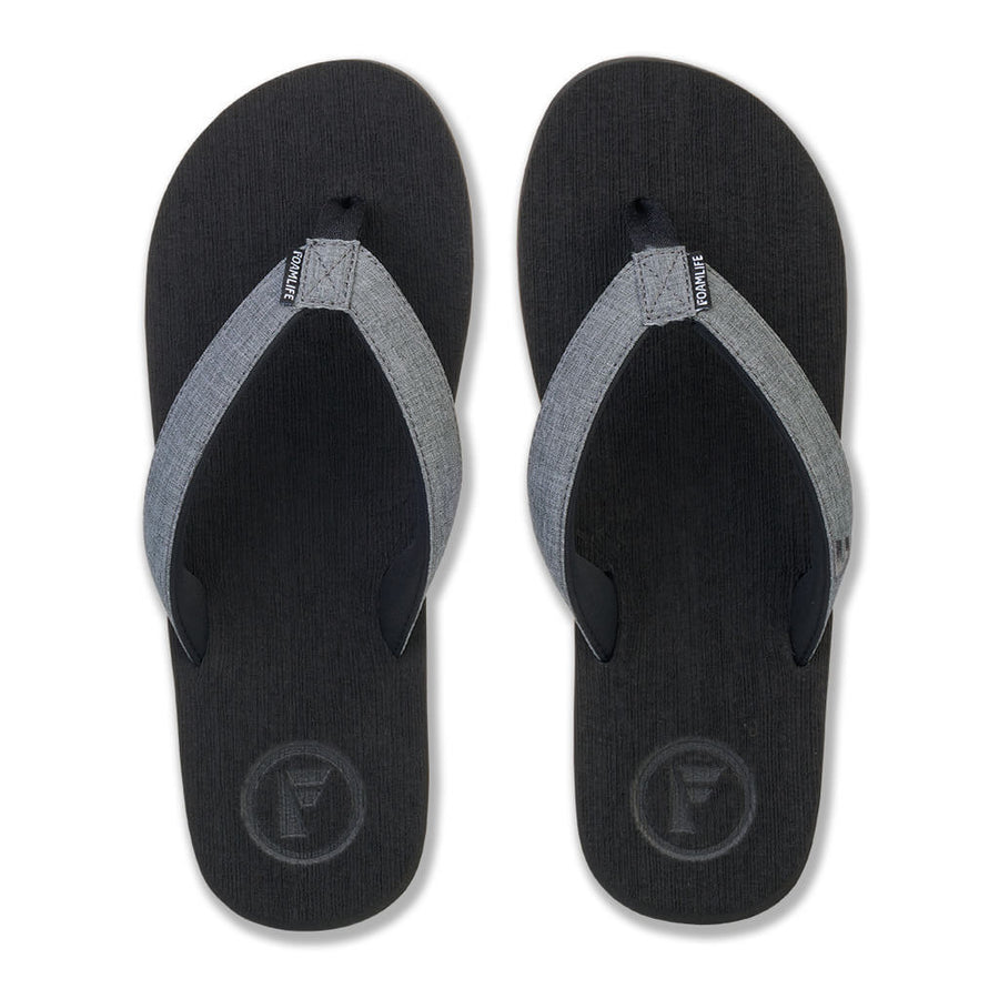 Top view of FoamLife Sharp men's black flip flops with stylish strap detail.