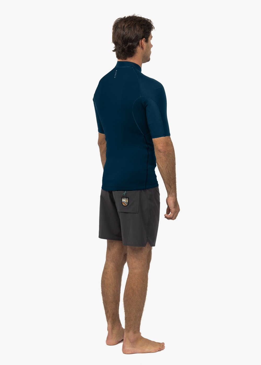 Vissla High Seas II 1mm short sleeve wetsuit jacket in navy, back view.