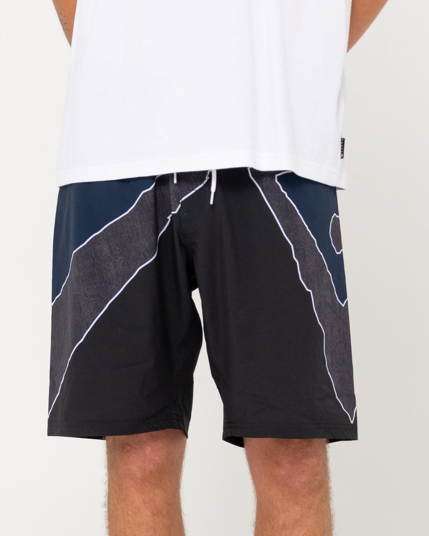 Rusty Illusion Boardshort with geometric design, back view.
