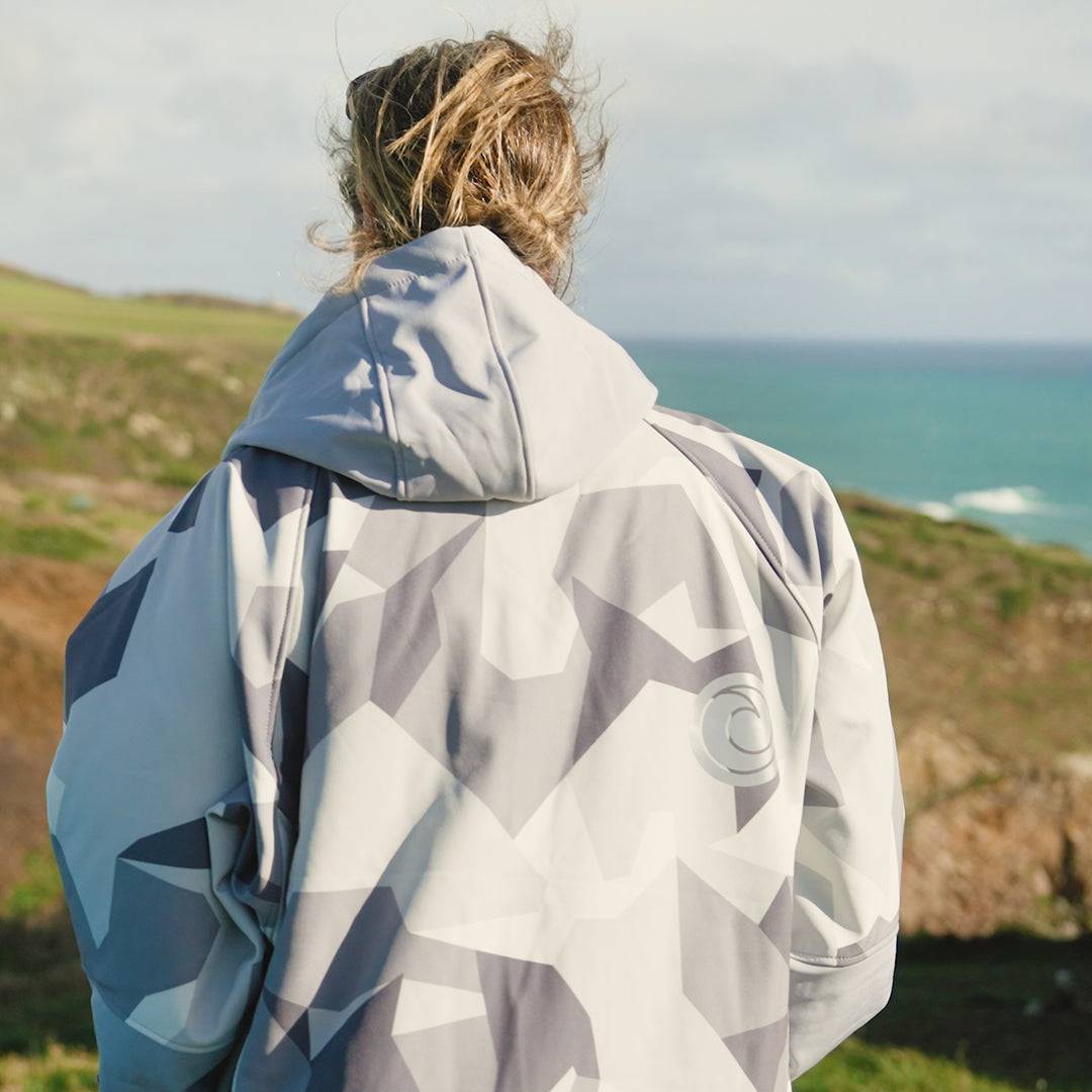 White Water Adult Soft Shell Robe in Arctic Camo, outdoor back view near coastline.