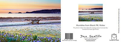 Dan Santillo greeting card showcasing Mumbles from Black Pill, Wales with a serene coastal view.