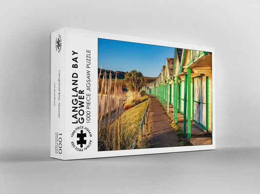 Dan Santillo Langland Bay jigsaw puzzle box featuring a scenic coastal view.