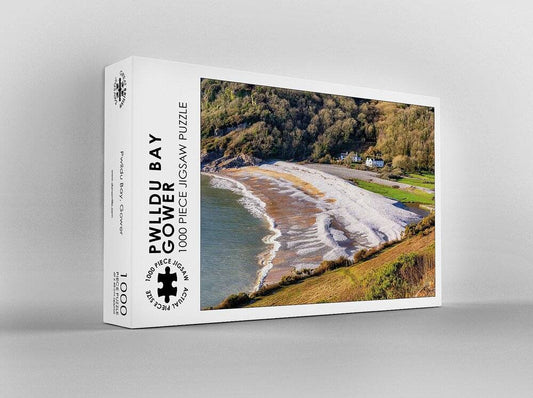 Dan Santillo Pwll Du jigsaw puzzle box featuring a scenic coastal view.
