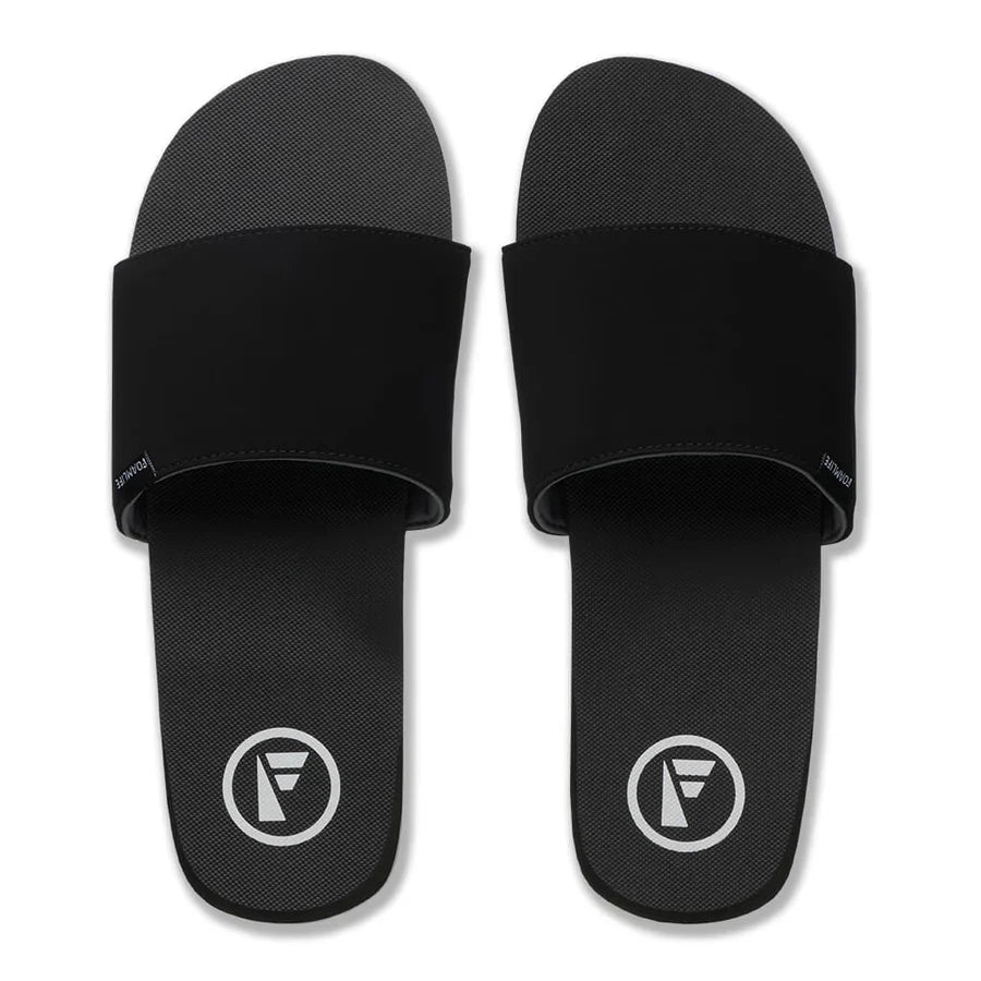 Top view of FoamLife Tarlan Slide black men's slider with logo detail.