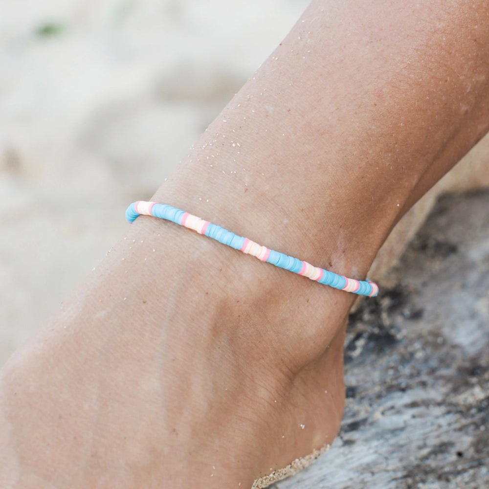 Beach-inspired Lucky Bay clay beaded anklet with pastel colors on ankle.