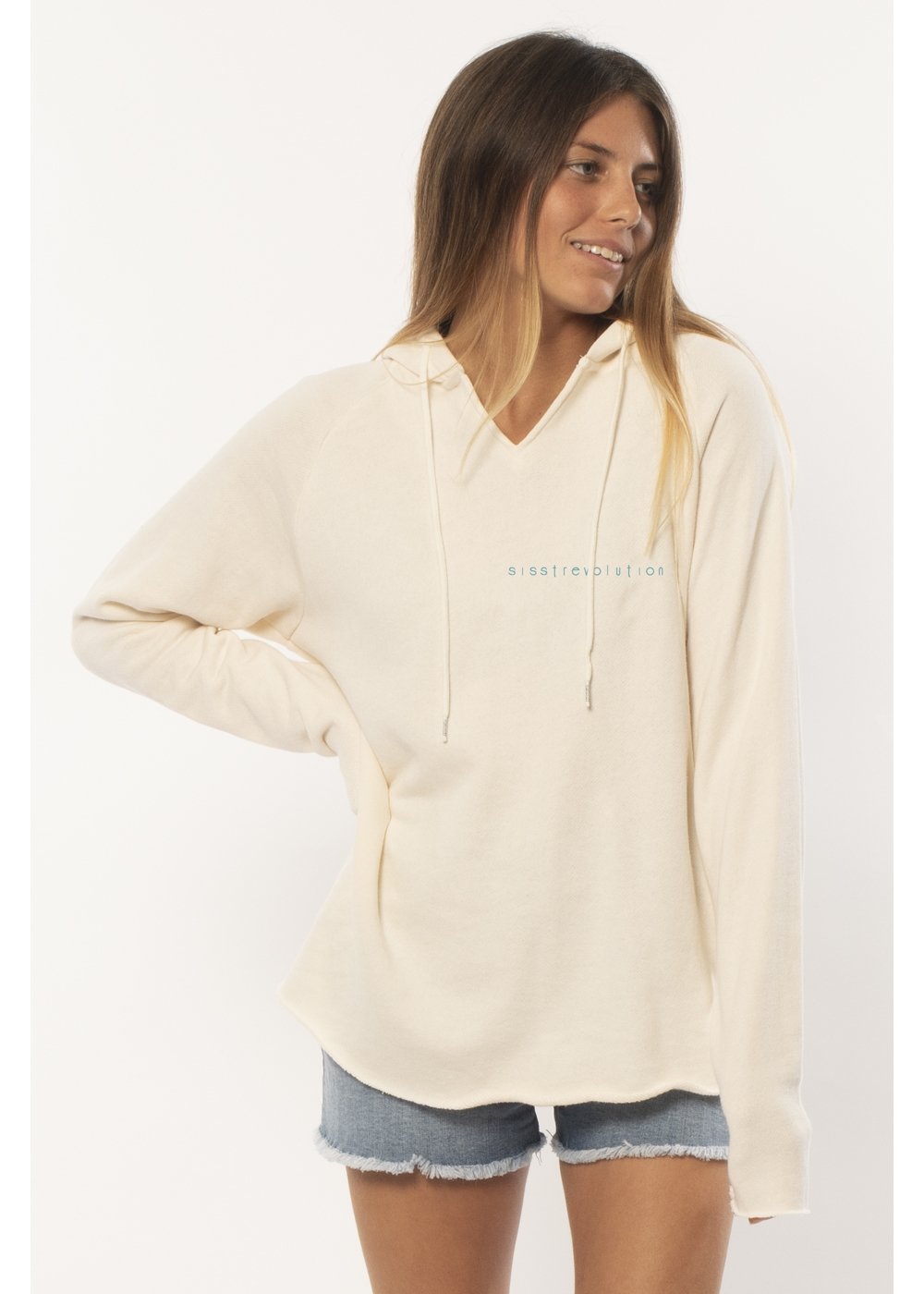Beige hoodie with a colorful wave design on the back, worn by a person against a white background.