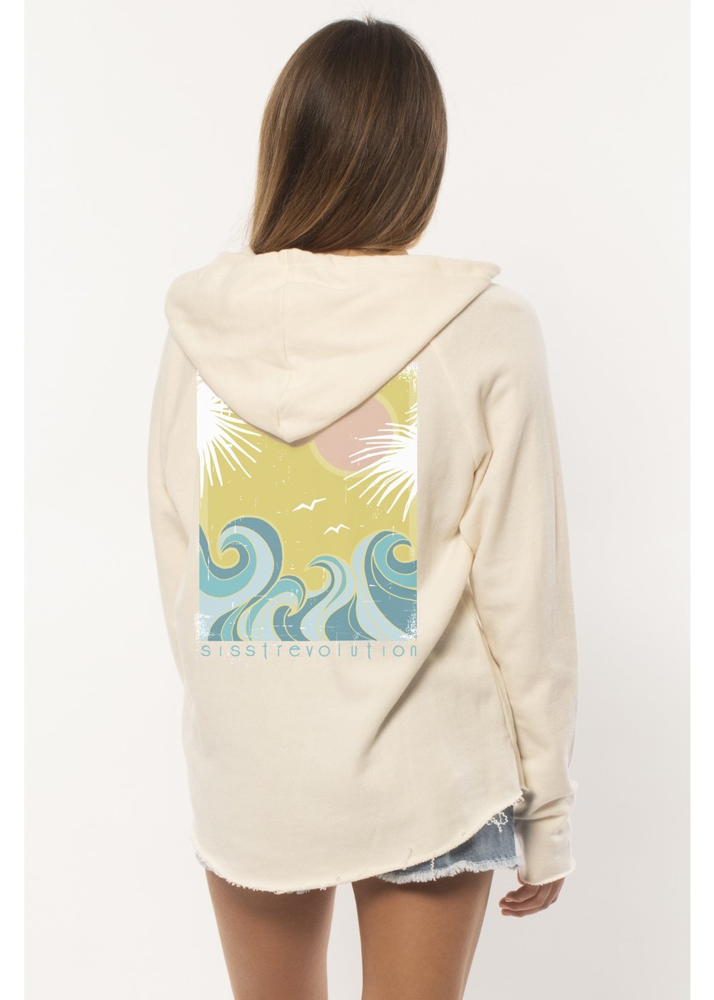Beige hoodie with a colorful wave design on the back, worn by a person against a white background.