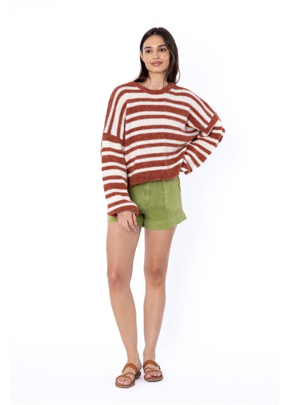 Rust and white striped Sisstr Ocean Shores Sweater styled with green shorts.