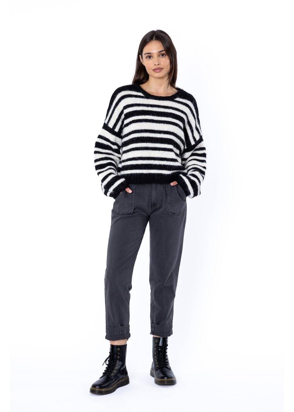 Rust and white striped Sisstr Ocean Shores Sweater styled with green shorts.