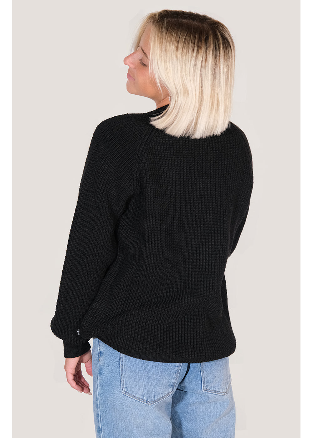 Back view of Sisstrevolution Barra Crew Sweater in black, styled casually.