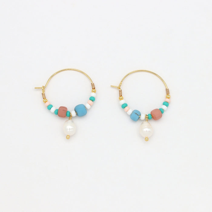 GIADA PECAHAN WIRE HOOP EARRINGS with pastel beads and pearl drop charm on gold hoops, perfect for boho-chic jewelry collections.