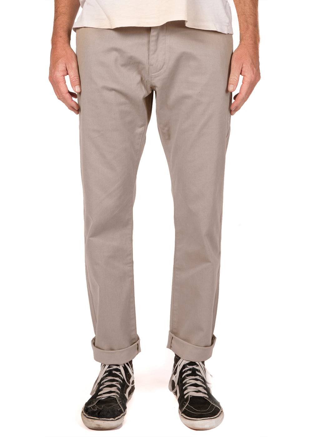 Vissla Creators Port Chino Pant in khaki, front view with cuffed hem.