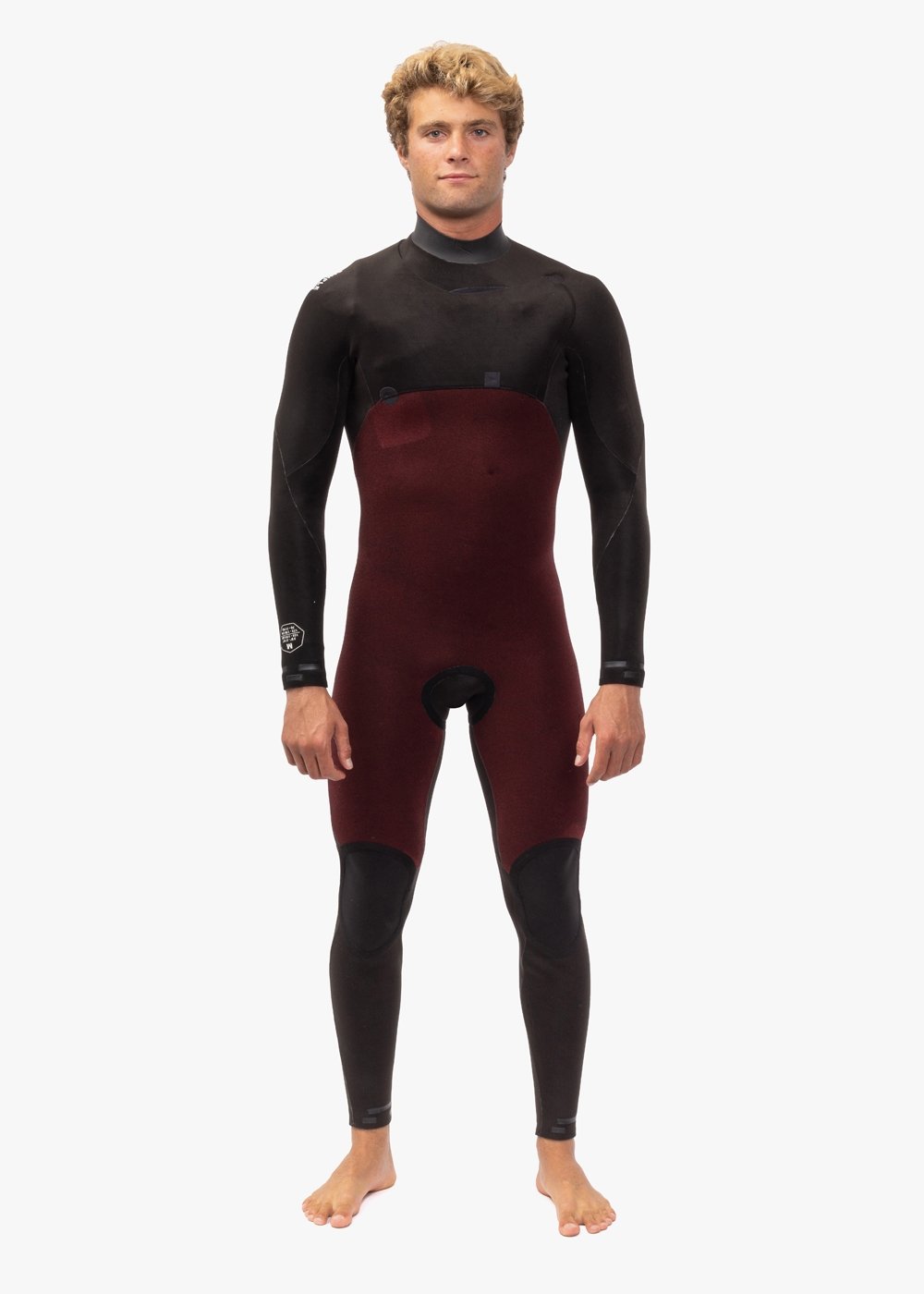 Front view of Vissla 7 Seas Comp 2-2 wetsuit showing interior red panel design.