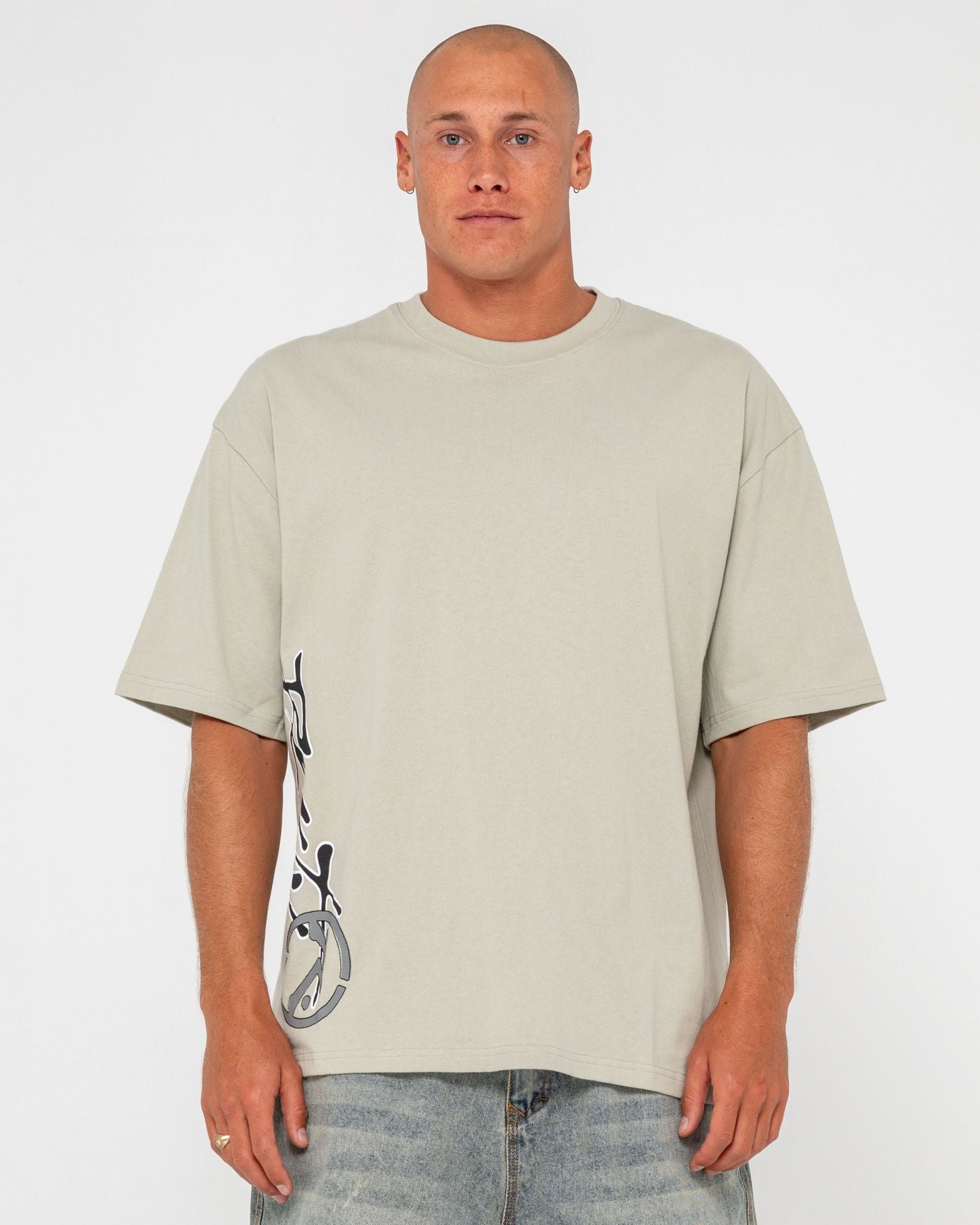 Front view of beige graphic t-shirt with logo on chest, short sleeves, casual men's fashion