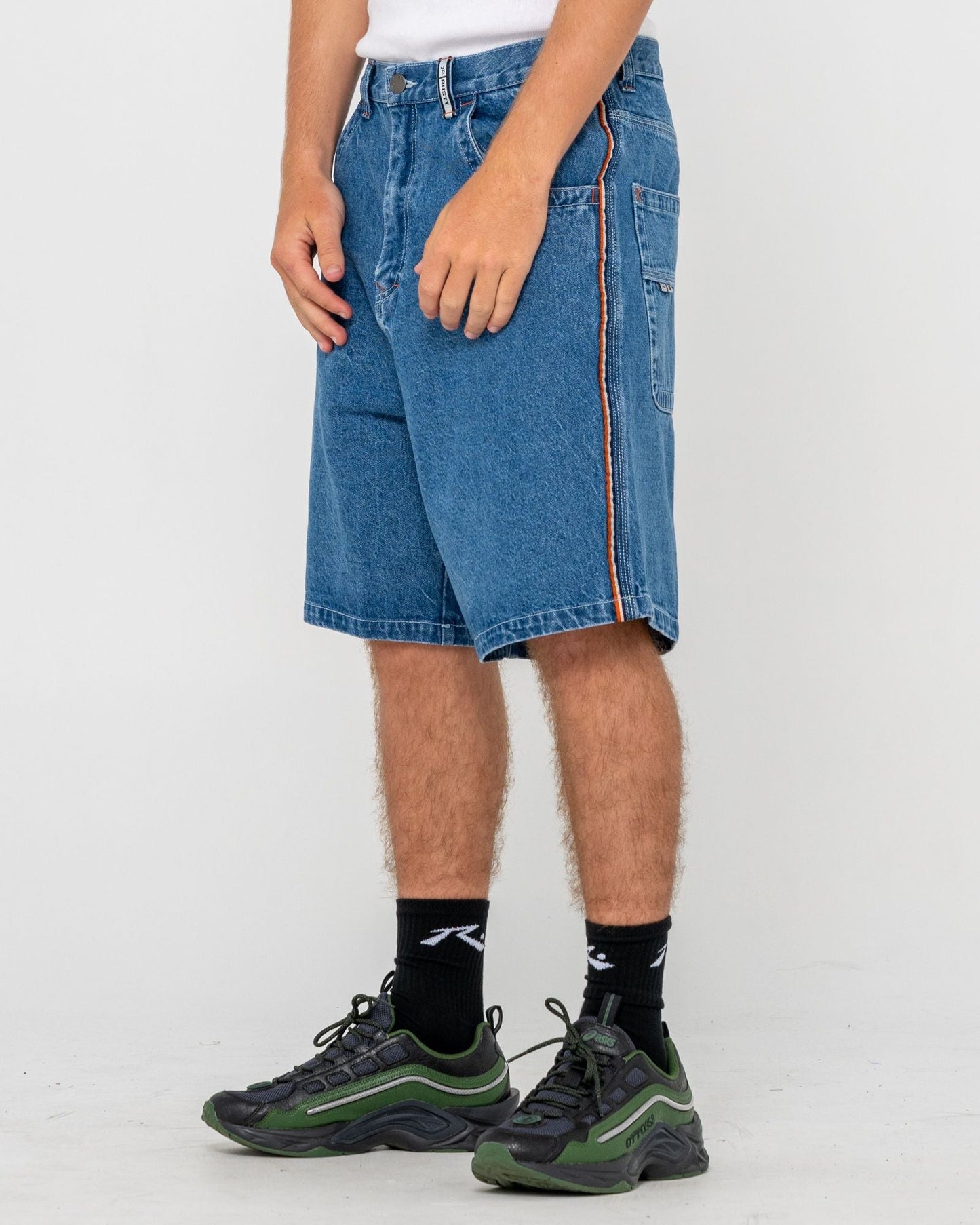 Men's baggy denim walkshorts with orange stitching and logo