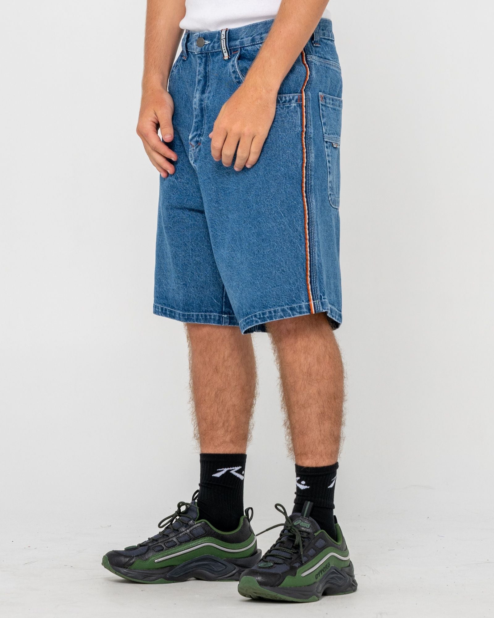 Men's baggy denim walkshorts with orange stitching and logo