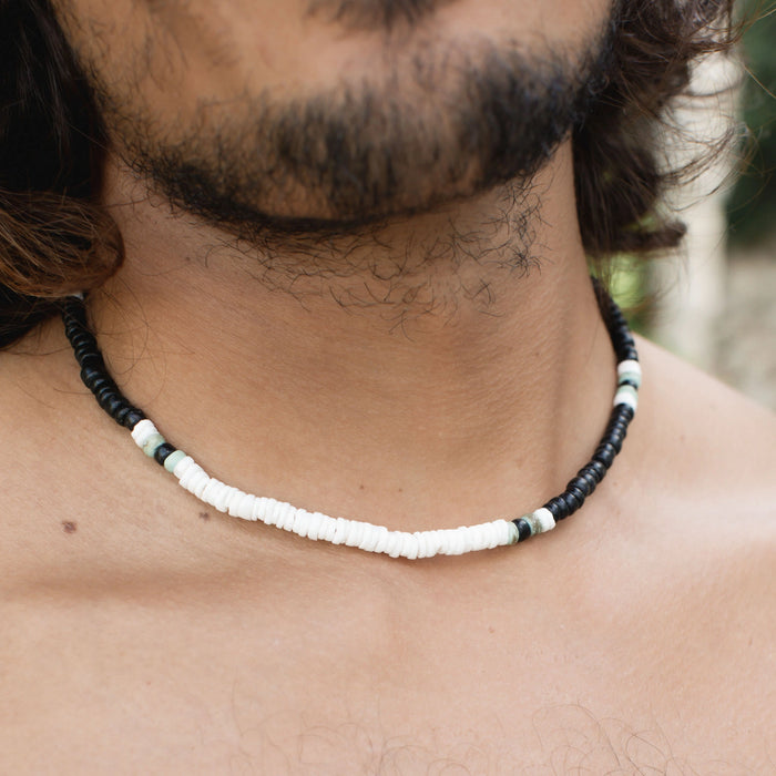 Stylish Marley surf bead necklace featuring black and white beads on a neck.