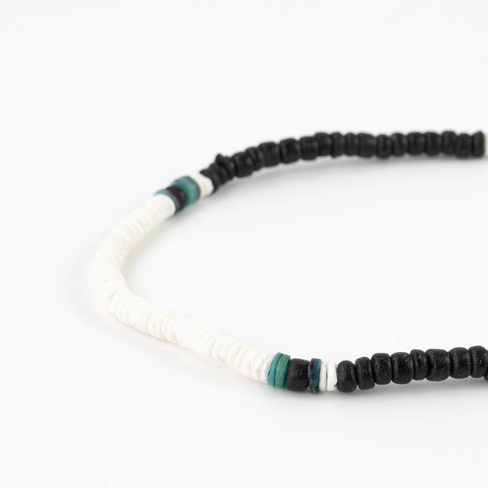 Detailed view of Marley surf bead necklace with alternating black and white beads.