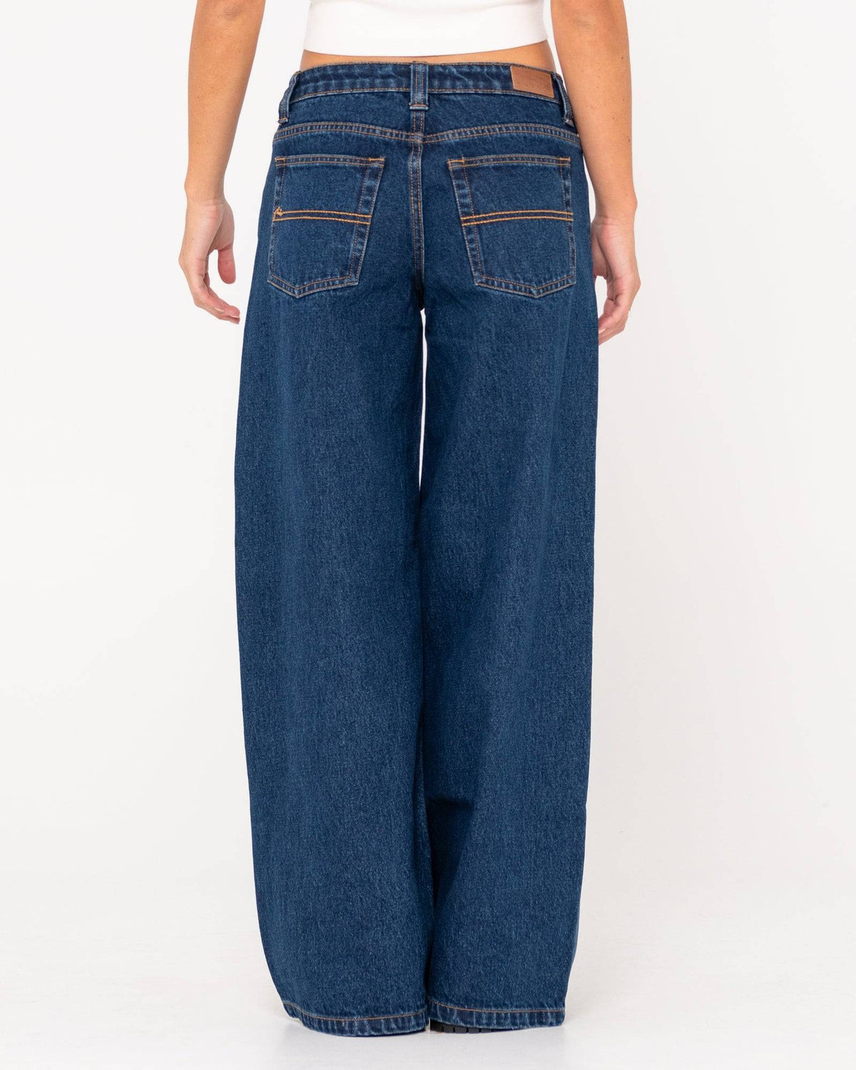 Back view of Rusty Low Rise Super Wide Leg Jean showcasing rear pockets.