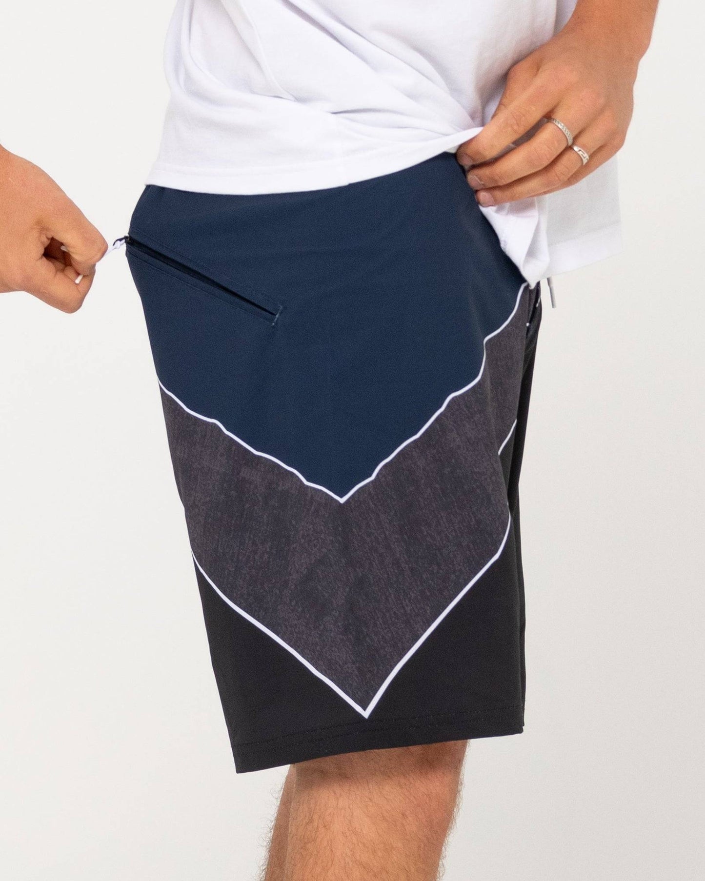 Rusty Illusion Boardshort with zippered pocket detail, close-up.