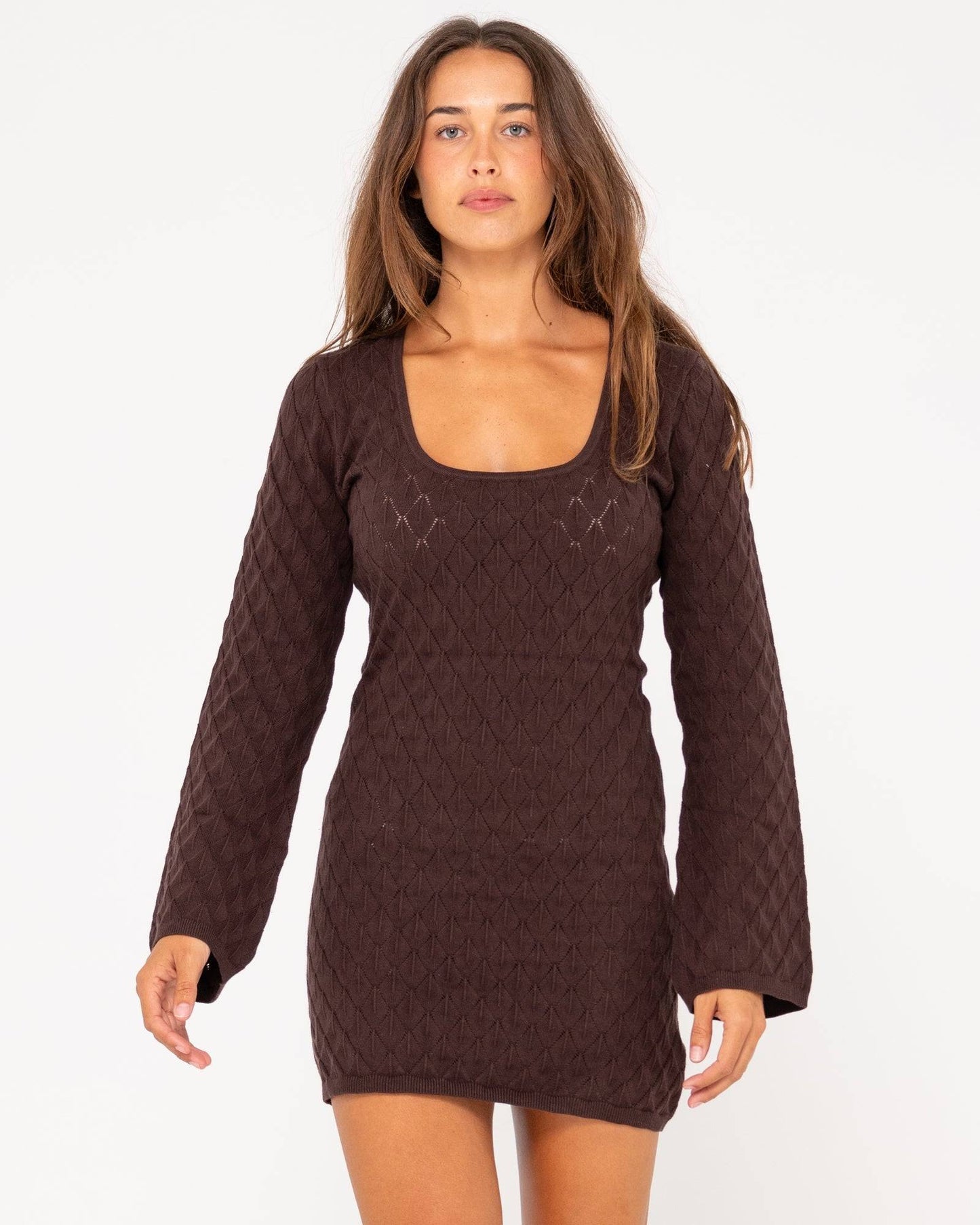Rusty Leo long sleeve knit mini dress in brown with a scoop neckline.