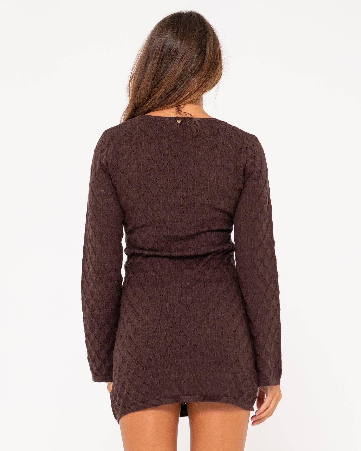 Back view of Rusty Leo long sleeve knit mini dress in brown with textured pattern.