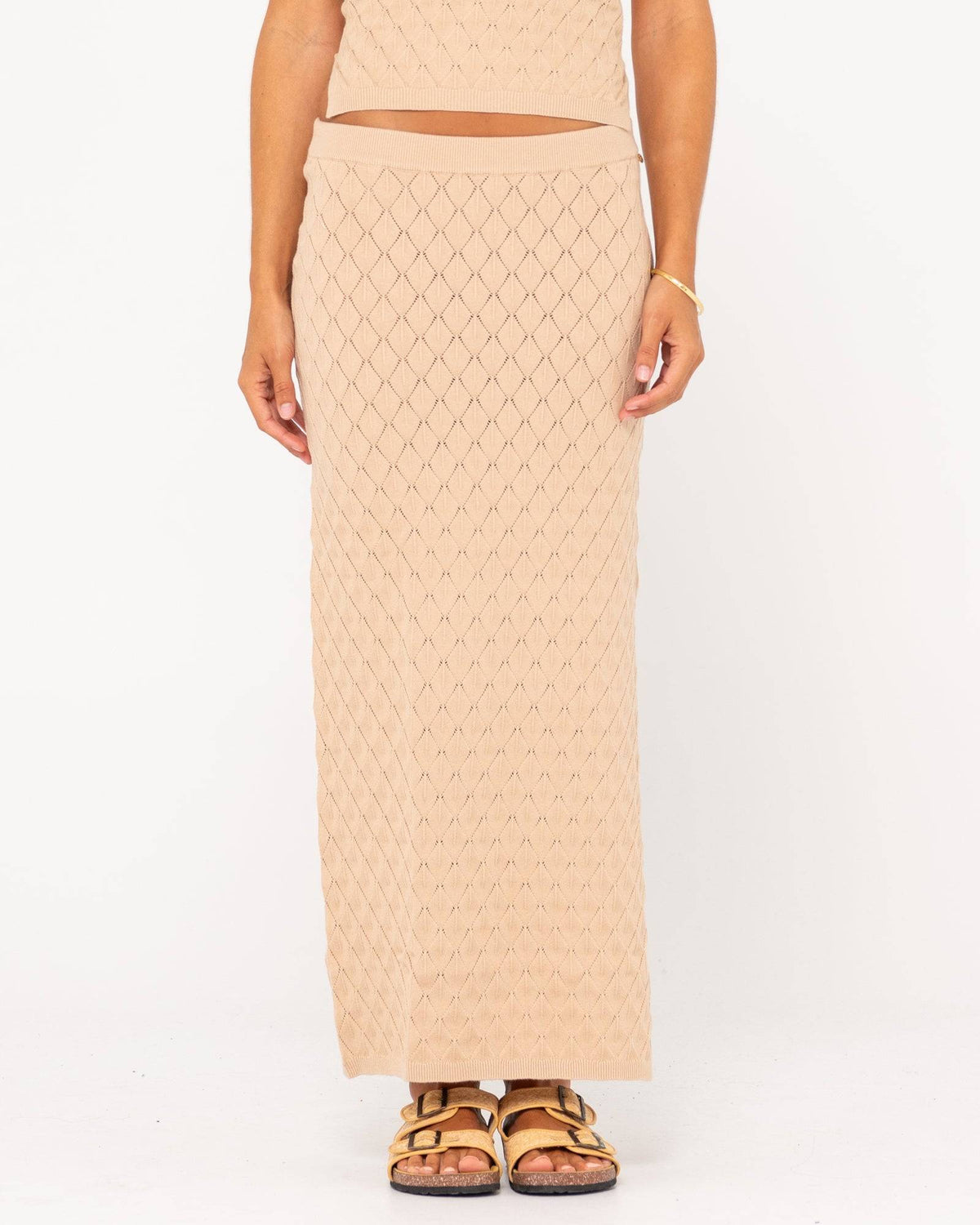 Front view of Rusty Leo Maxi Knit Skirt with diamond pattern and high waist.