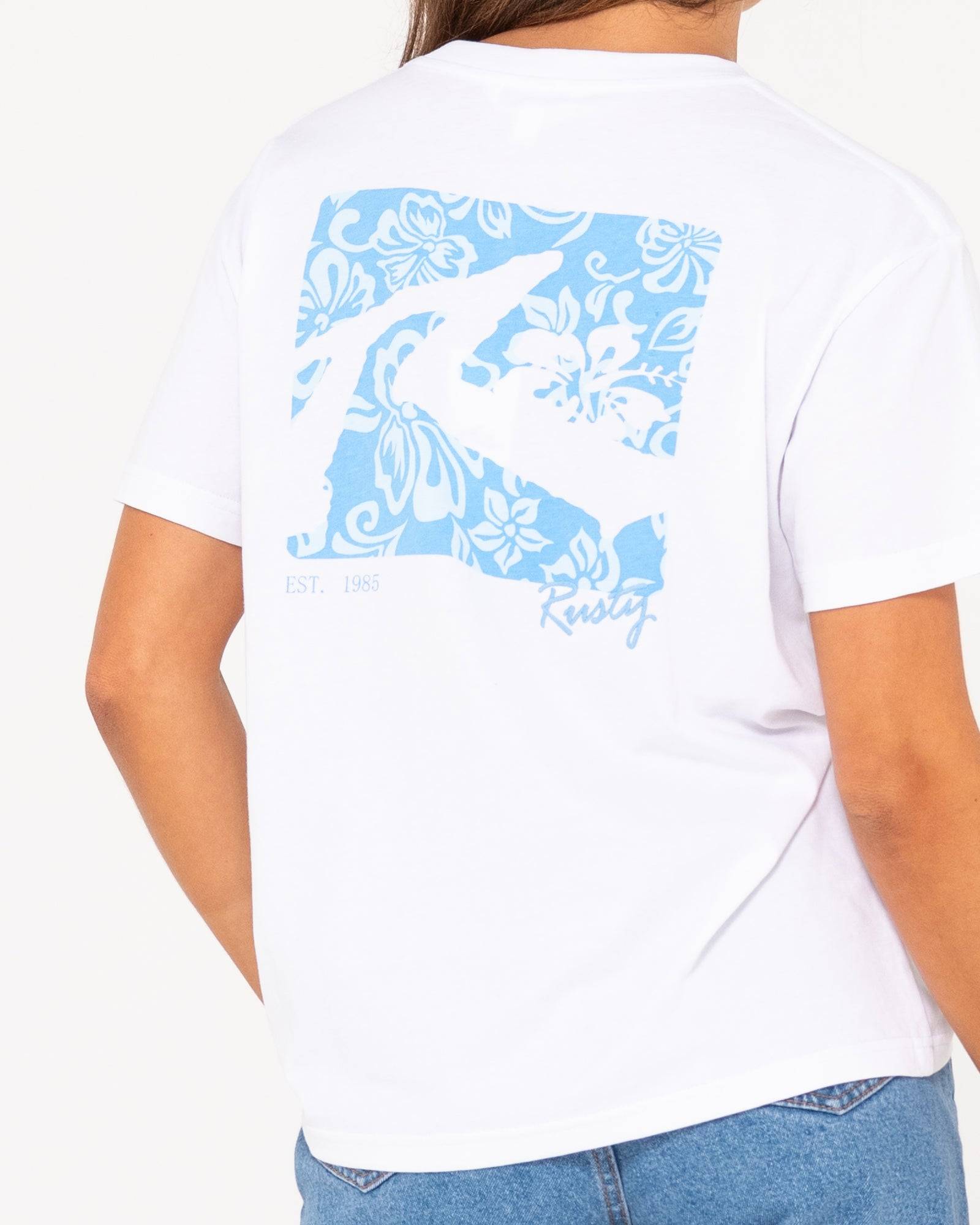 Close-up of back design on Rusty Jill Standard Fit Tee with blue floral print.