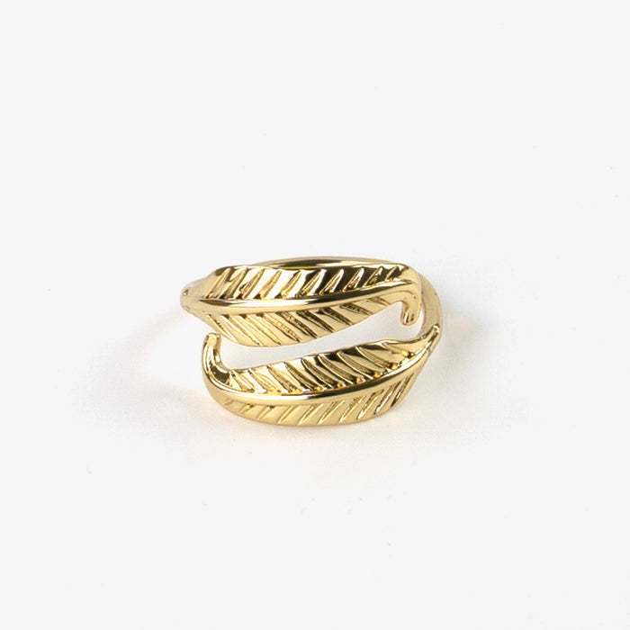 Gold Pineapple Island Bocca Feather Ring worn on a hand, showcasing its elegant design.