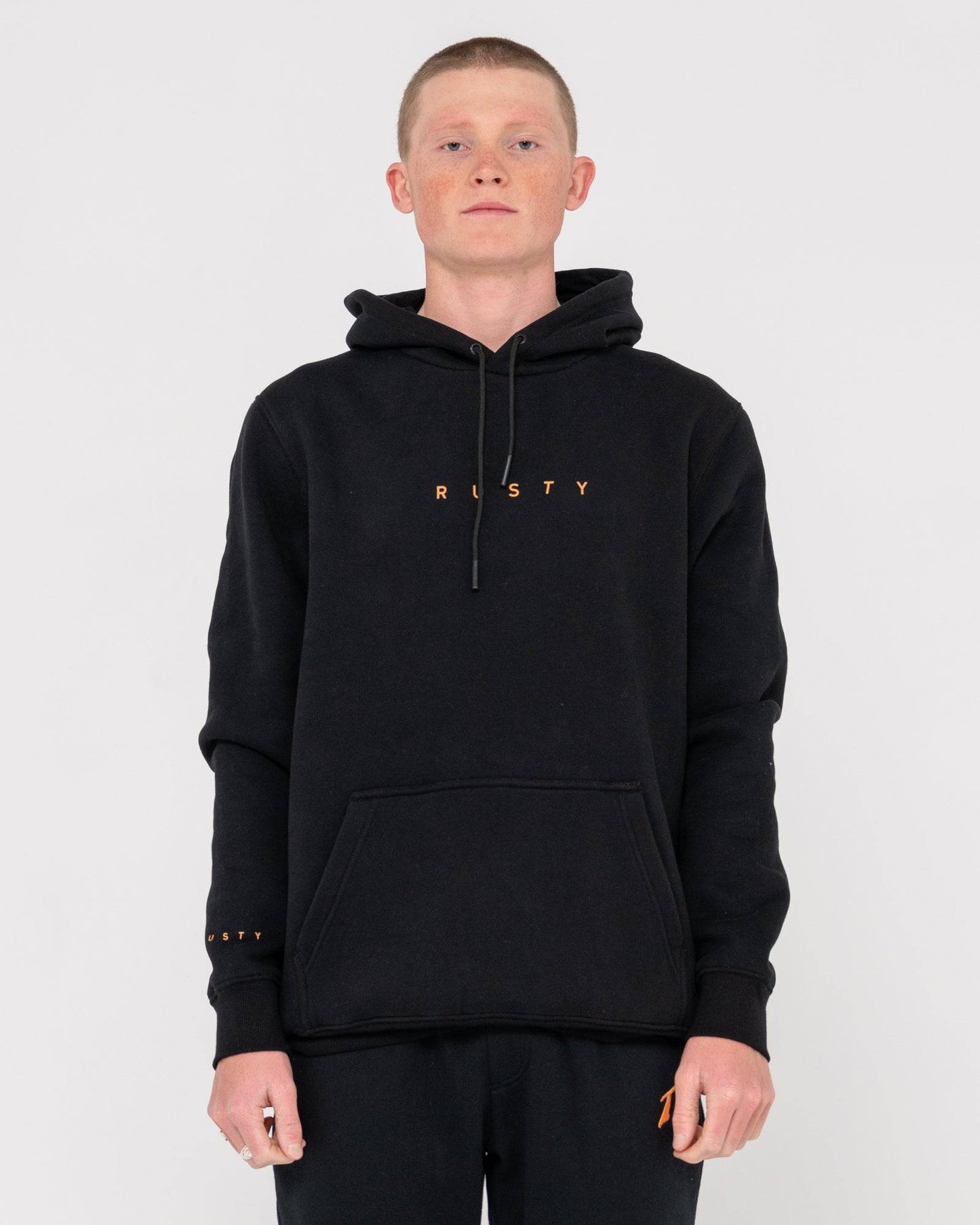 Front view of Rusty Short Hooded Fleece - Standard Fit Hoodie in black with orange logo, featuring kangaroo pocket and drawstring hood.