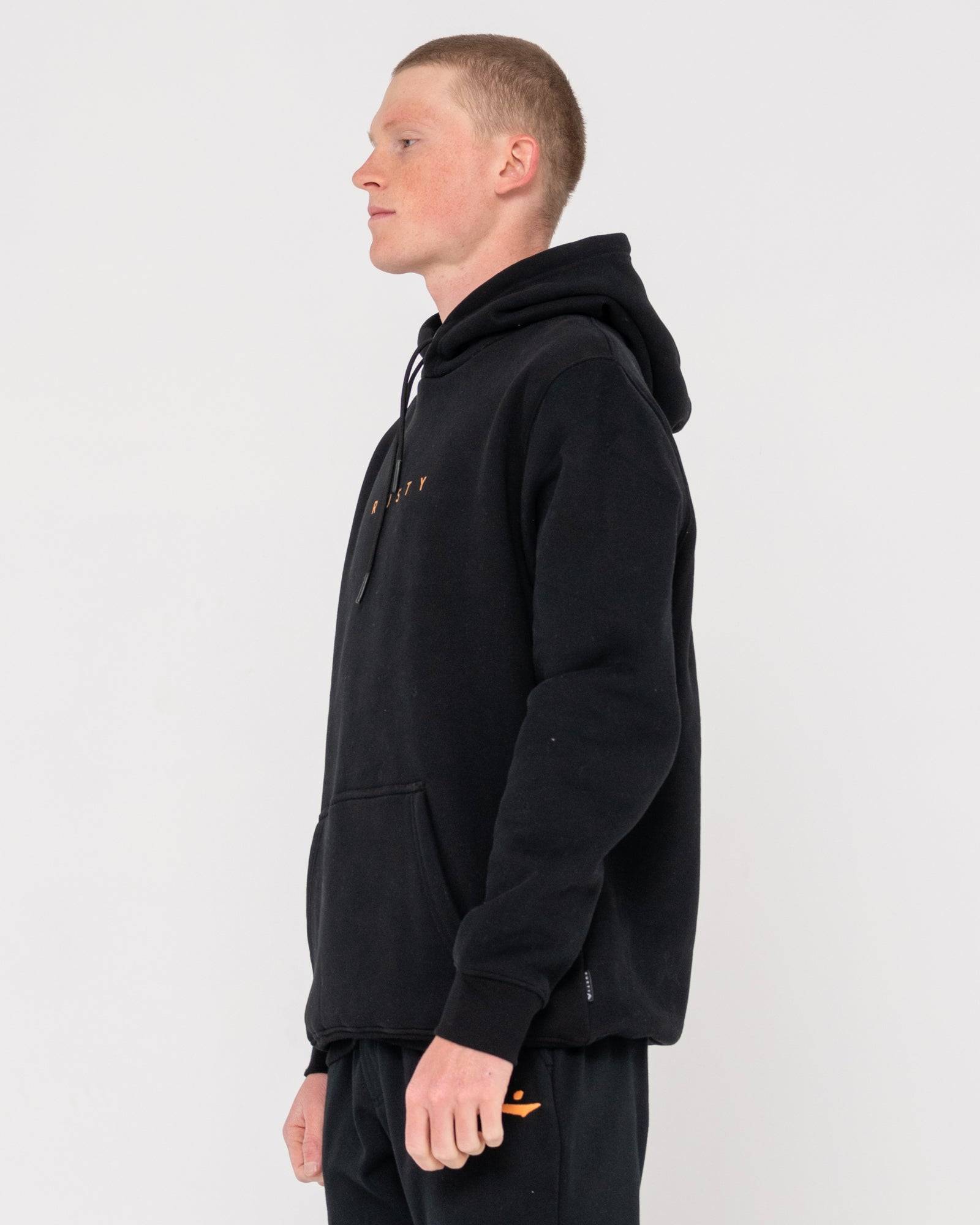Side profile of Rusty Short Hooded Fleece - Standard Fit Hoodie in black, highlighting its clean silhouette and standard fit.