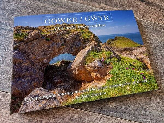 Hidden Gower Destinations Book by Dan Santillo features a scenic coastal rock arch on its cover, showcasing lesser-known Gower landscapes.