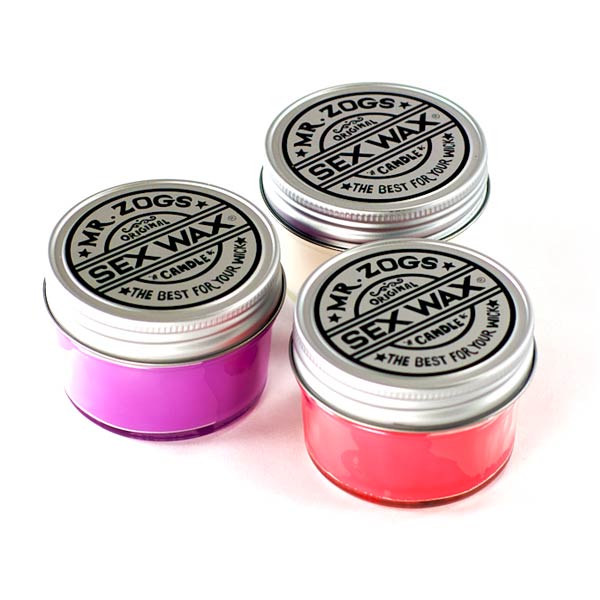 Set of three Mr. Zog's SexWax candles in vibrant purple, red, and white.