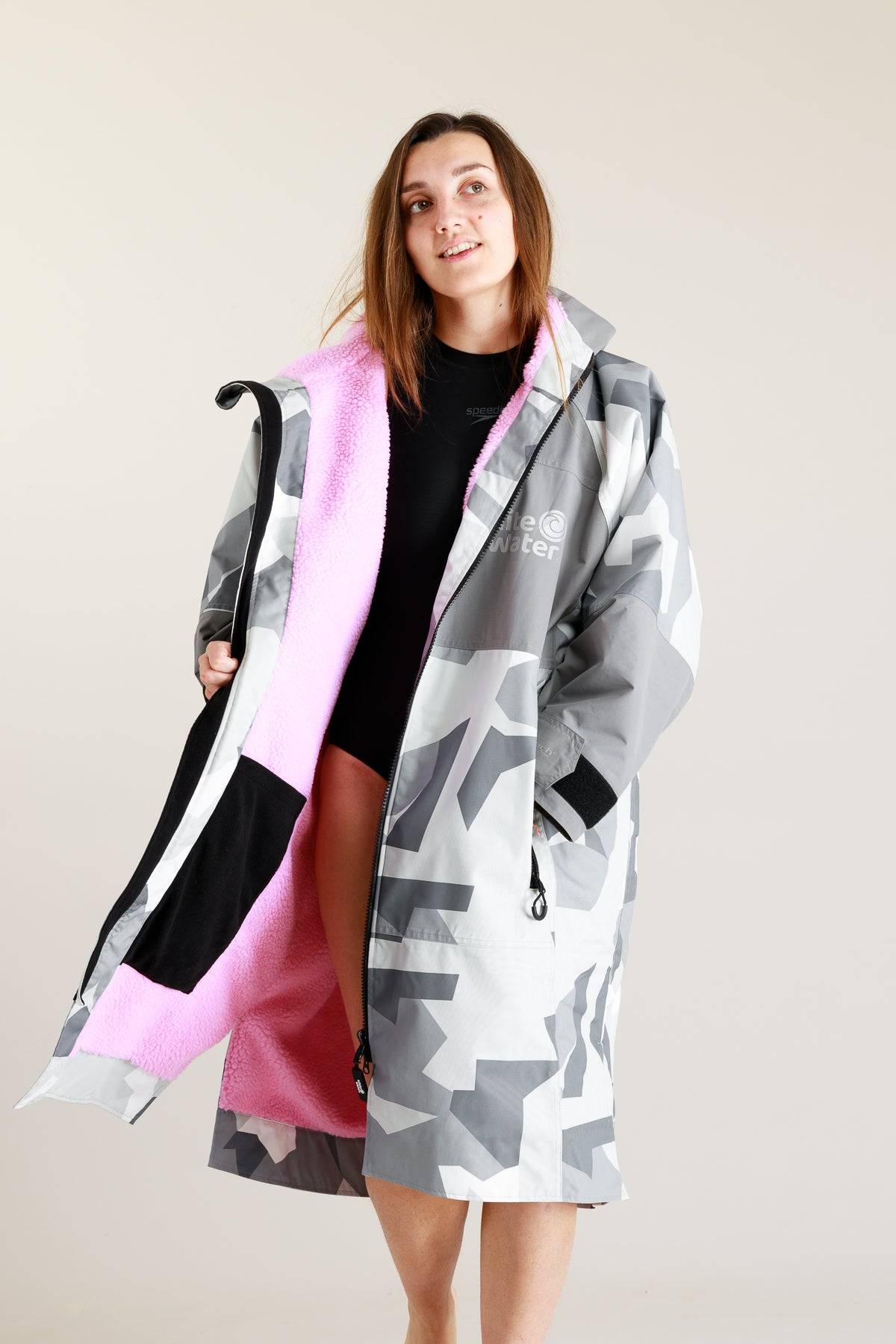 White Water adult hard shell robe in Arctic camo with pink lining, partially unzipped.