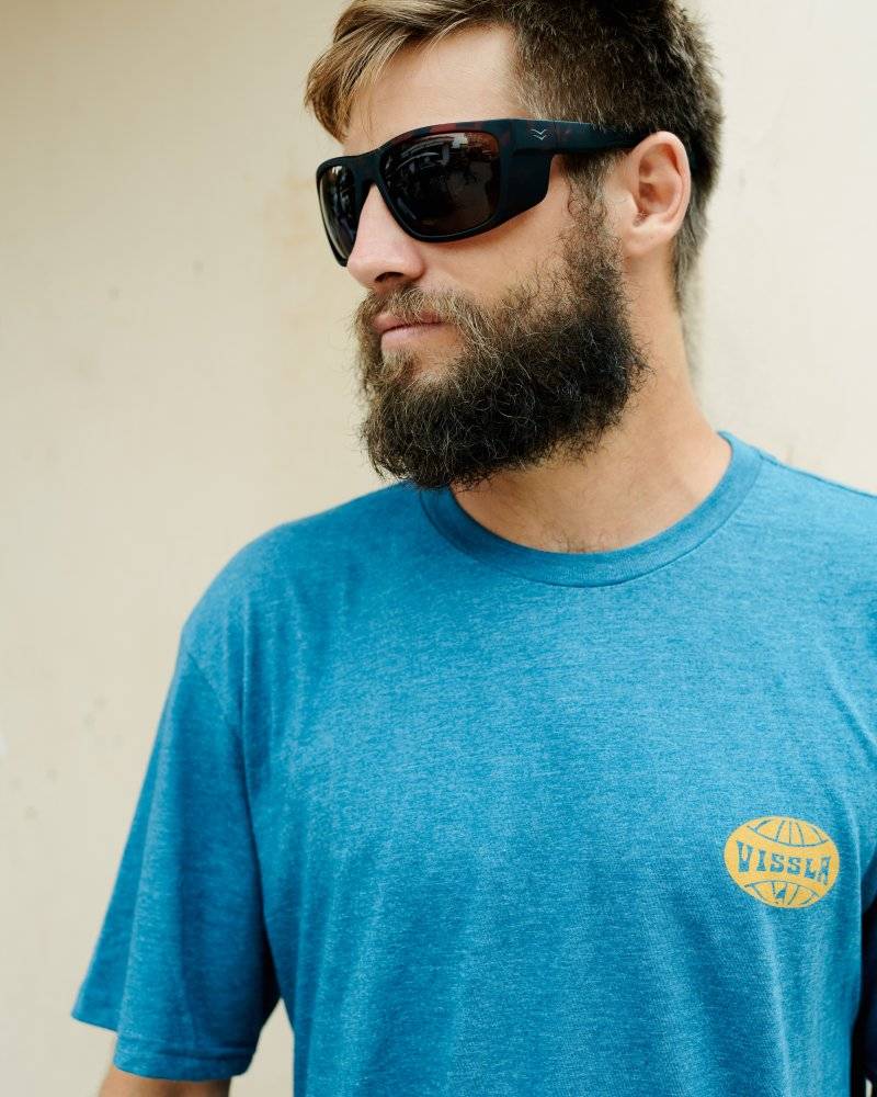 Close-up of a man wearing I-sea Greyson 2.0 sunglasses with a tortoise frame.
