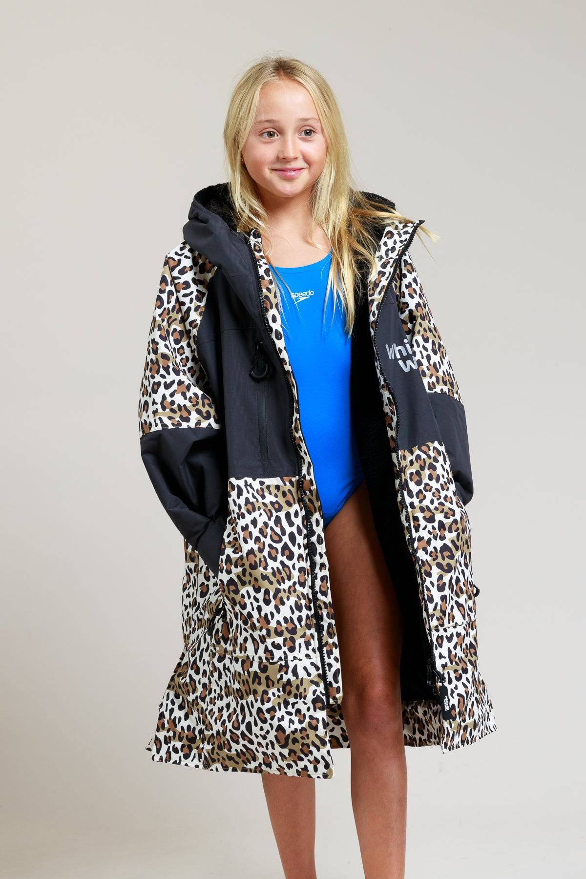 White Water kids leopard print robe with open front, revealing swimsuit.