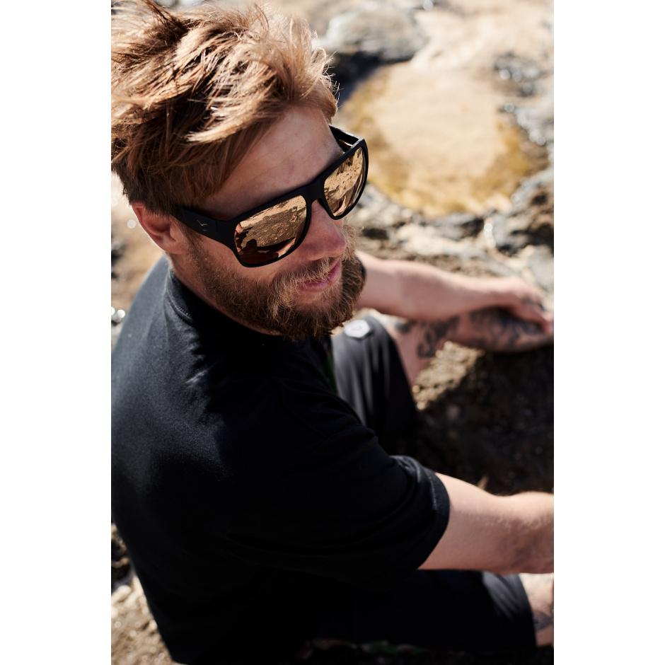 Close-up of man wearing I-Sea Nick I Waterman sunglasses with copper mirror polarized lenses.