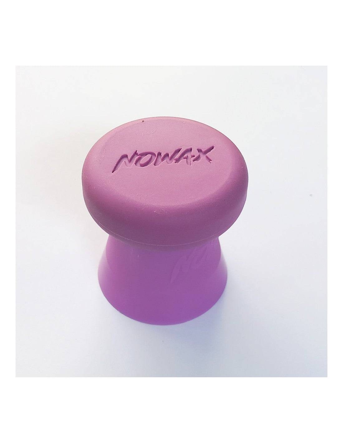 Purple NoWax ergonomic surfboard wax remover with a double-edged design for efficient wax removal.