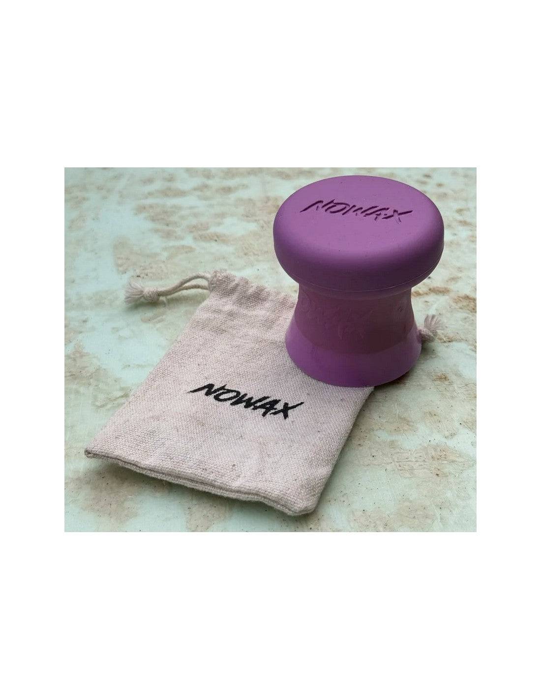 NoWax surfboard wax remover in purple with a branded storage pouch, ideal for outdoor water sports.