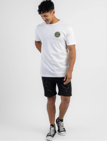 Full-body view of the Sexwax Word Fade Tee in green, styled with black shorts.